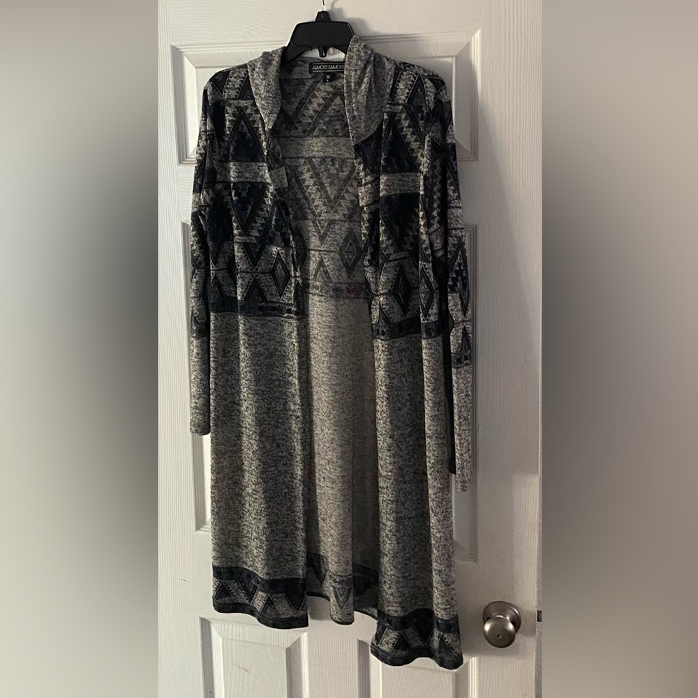 long sweater 41 inches long grey with black & blue design. Size Large